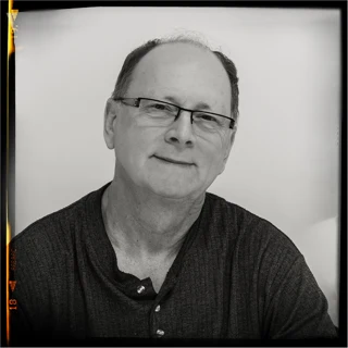 Jean-Jacques Micheli, founder of the MikeMuka studio, black-and-white portrait